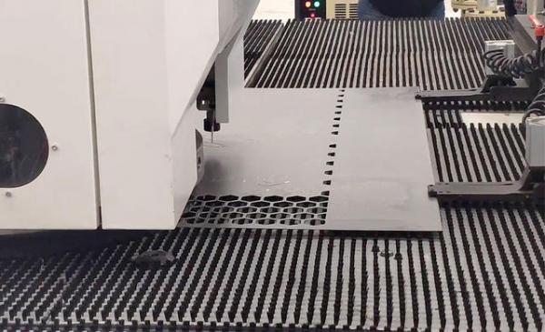 Perforated metal production machine in the production process