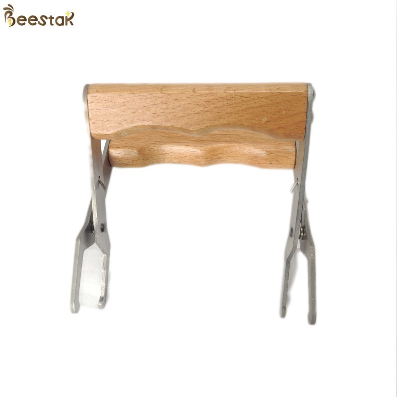 China Beekeeping Apiculture Tools Stainless Steel Bee Hive Frame Grip With Wooden Handle factory