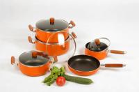 China Orange 9pcs Aluminum Nonstick Cookware Set With Wooden Handle factory