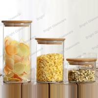 China High quality round cylinder glass candy jar crystal glass jar with wood lid factory