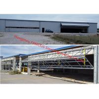 China Vertical Bi Fold Hangar Door Solution Light Steel Single Panel Hydraulic Airplane Door System factory
