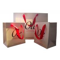 China Custom Printed White Paper Gift Bags Wholesale Spot UV Logo Ribbon Handle factory