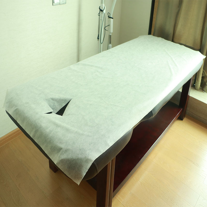 China Dispoable Spunbond Non Woven Massage Table Bed Sheet With Facial Hole Pink Blue Color factory