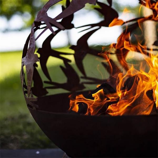 Quality Wood Burning Laser Cut Design Oxidised Corten Steel Swallows Globe Fire Pit for sale