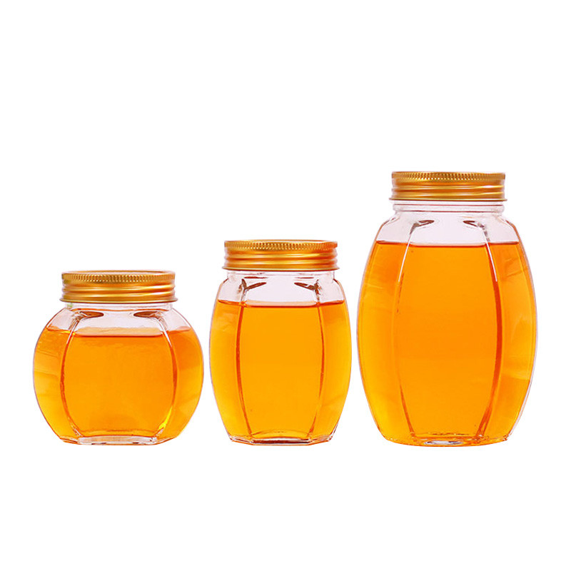 China Metal Lid Glass Honey Jar Hexagon Shape Recyclable Food Storage Container factory