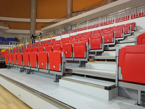 Quality Electrical Control HDPE Retractable Bleacher Seating With Folding Armrest for sale