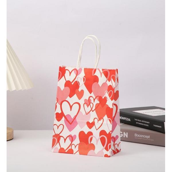 Quality Red 80gsm Kraft Paper Gift Bags Love Heart Printed Paper Goodie Bags With Handles for sale