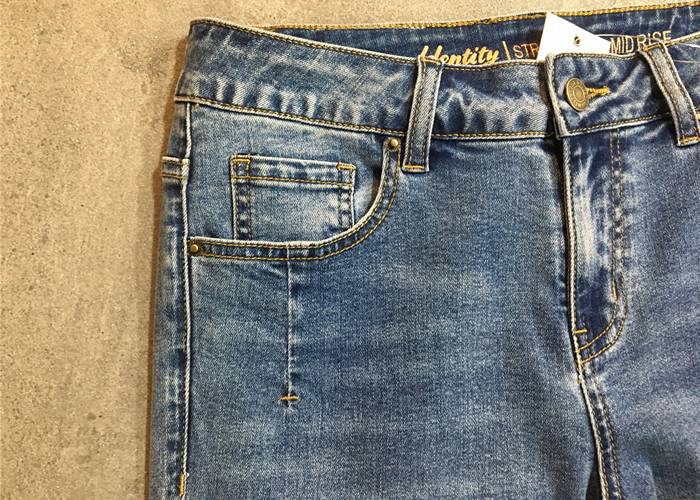 light wash straight leg ladies denim jeans with hem rolled