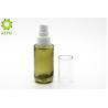 China 30ml Green Glass Foundation Bottle Round Shape With White Plastic Pump Cap factory