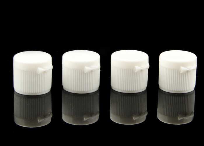 China 18mm 20mm Plastic Cosmetic Bottle Caps Flip Top White Ribbed Surface Customized factory