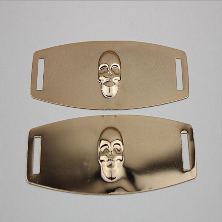 China Eco-friendly plating iron sheets gold color embossed skull logo shoe metal buckles for shoelace factory