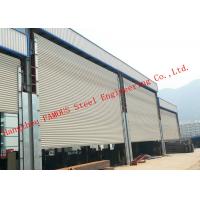 China Frequency Controlled Vertical Lifting Fabric Industrial Doors For Large Openings factory