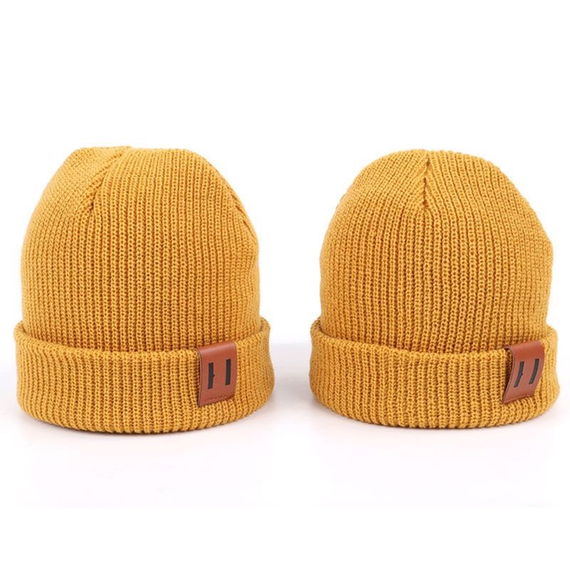 China Leather Patch Knit Beanie Hats Custom Design Warm Hat Cap Yellow Beanie Hats factory