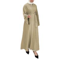 China Fashionable Muslim Tops Women Muslim Dress Solid Color Flared Sleeve Mosaic Clothing factory