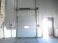 China Outside Galvanized Steel Frame Industrial Sectional Doors With High frequency Motor factory