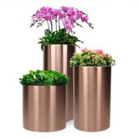 China Sus 304 Mirror Round Metal Flower Pots Metal Flower Planter For Park Mall factory